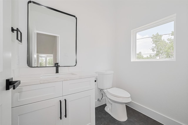 3114 Orange St, Houston, TX 77020 - bathroom with vanity, baseboards, a wealth of natural light, and toilet