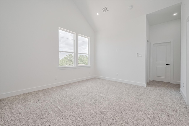3114 Orange St, Houston, TX 77020 - spare room featuring visible vents, baseboards, lofted ceiling, and light colored carpet