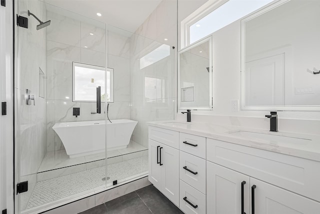 3114 Orange St, Houston, TX 77020 - full bath featuring a sink, tile patterned flooring, a shower stall, and double vanity