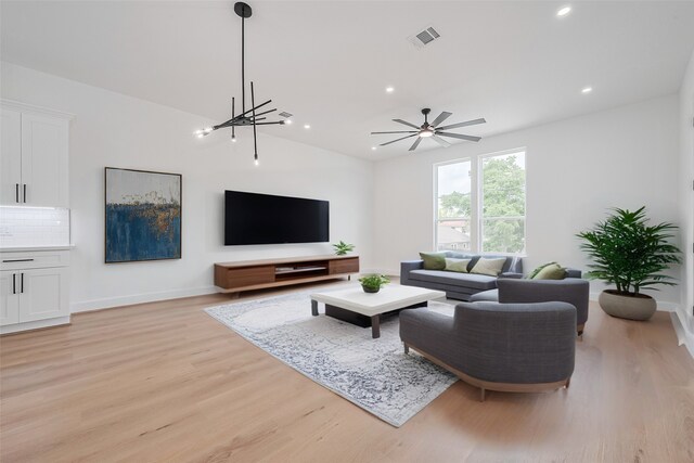 3114 Orange St, Houston, TX 77020 - living area with ceiling fan, visible vents, baseboards, light wood finished floors, and recessed lighting