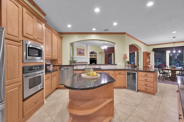 13262 Royal Rdg, Conroe, TX 77302 - kitchen featuring stainless steel appliances, beverage cooler, recessed lighting, crown molding, and a kitchen island