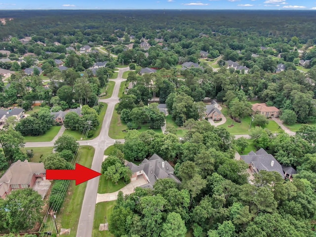 13262 Royal Rdg, Conroe, TX 77302 - aerial overview of property's location with nearby suburban area and a heavily wooded area