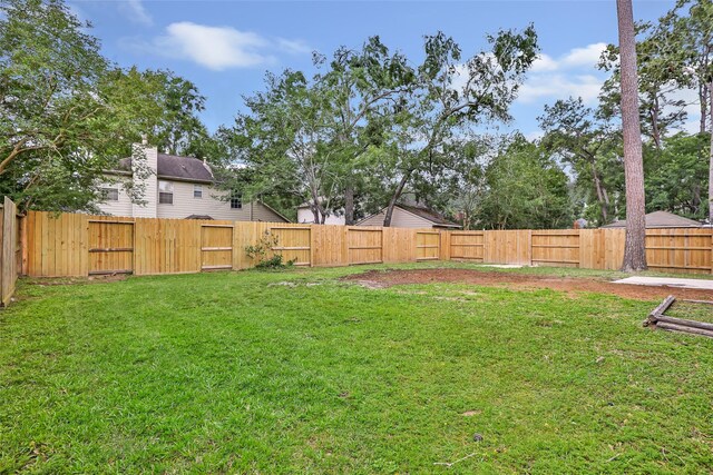 4523 Natural Bridge Dr, Kingwood, TX 77345 - view of yard with a gate