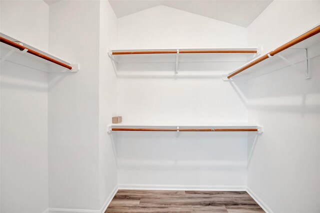 4523 Natural Bridge Dr, Kingwood, TX 77345 - walk in closet with wood finished floors and lofted ceiling