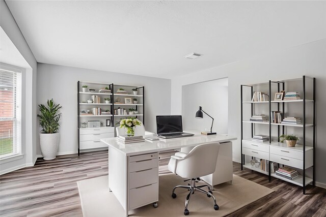 4523 Natural Bridge Dr, Kingwood, TX 77345 - home office featuring light wood finished floors and baseboards