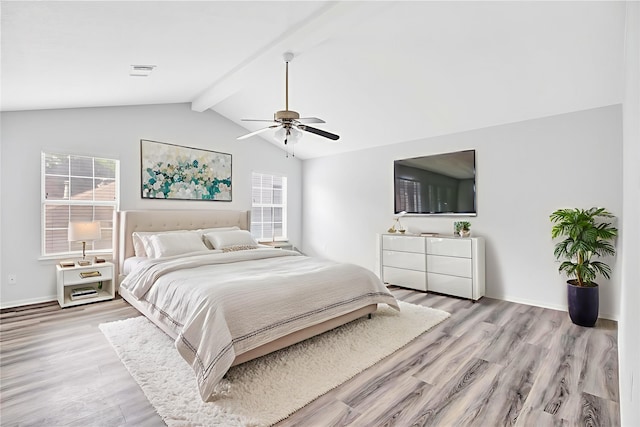 4523 Natural Bridge Dr, Kingwood, TX 77345 - bedroom featuring multiple windows, light wood finished floors, and a ceiling fan