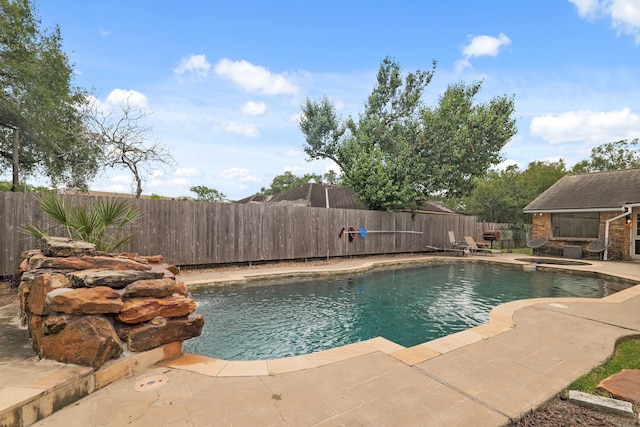 view of swimming pool with a patio, a fenced backyard, and a fenced in pool
