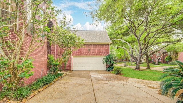 16 Treverstone Ct, Sugar Land, TX 77479 - exterior space with brick siding, an attached garage, driveway, and a shingled roof