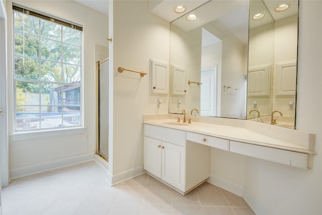 16 Treverstone Ct, Sugar Land, TX 77479 - bathroom with vanity, baseboards, tile patterned flooring, and a shower stall