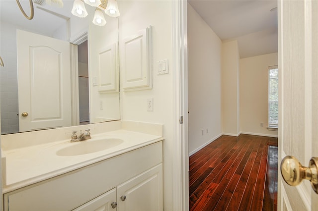 16 Treverstone Ct, Sugar Land, TX 77479 - bathroom featuring baseboards, wood finished floors, and vanity