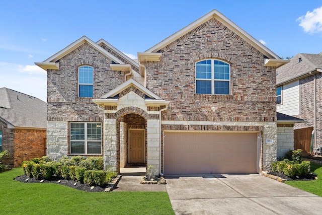 view of front of home with a garage, a front yard, stone siding, brick siding, and driveway