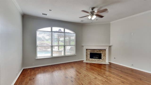 12107 Canyon Mills Dr, Houston, TX 77095 - unfurnished living room with ceiling fan, wood-type flooring, baseboards, a high end fireplace, and crown molding