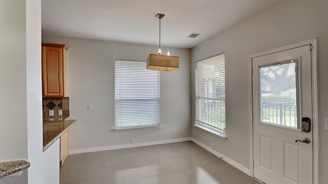 12107 Canyon Mills Dr, Houston, TX 77095 - unfurnished dining area featuring baseboards