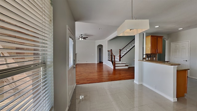 12107 Canyon Mills Dr, Houston, TX 77095 - kitchen featuring arched walkways, recessed lighting, open floor plan, a ceiling fan, and baseboards