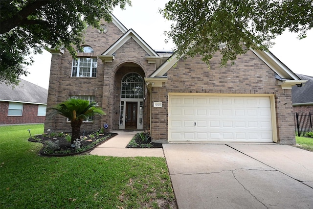12107 Canyon Mills Dr, Houston, TX 77095 - traditional-style house with driveway, brick siding, and an attached garage
