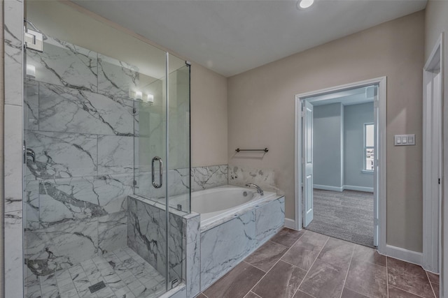 full bathroom with a garden tub, recessed lighting, a marble finish shower, and baseboards