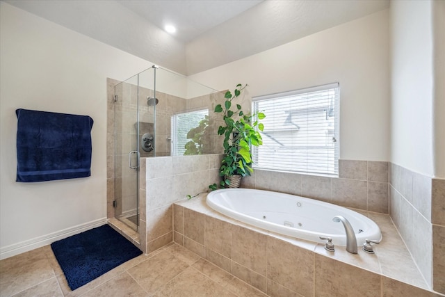 bathroom featuring tile patterned flooring, a stall shower, and a tub with jets