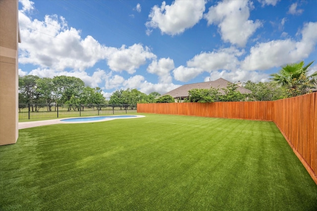 view of yard featuring a fenced in pool and a fenced backyard