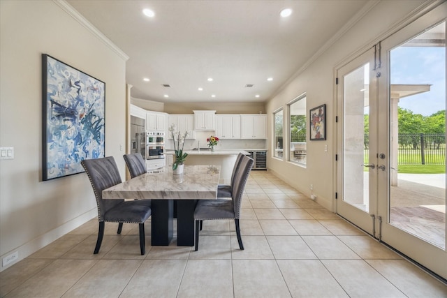 dining space with recessed lighting, baseboards, light tile patterned floors, visible vents, and ornamental molding