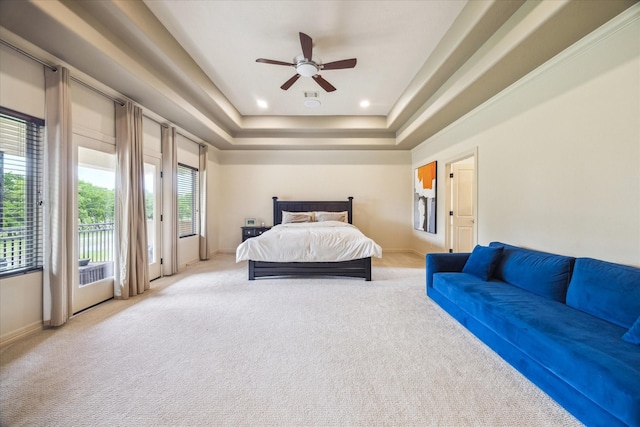 bedroom featuring carpet floors, access to outside, baseboards, and a raised ceiling
