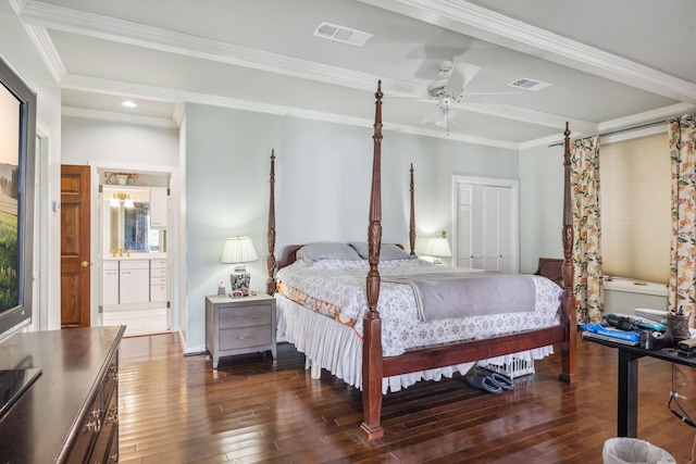 bedroom with ornamental molding, dark wood finished floors, and visible vents