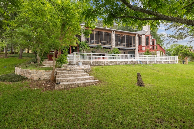 view of yard with a sunroom