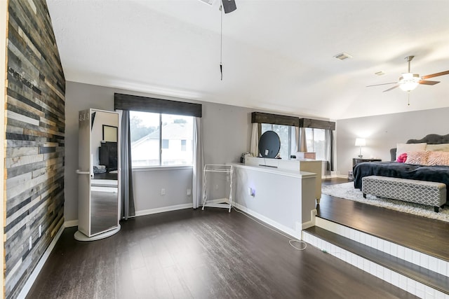 bedroom featuring dark wood-type flooring, a ceiling fan, baseboards, and visible vents