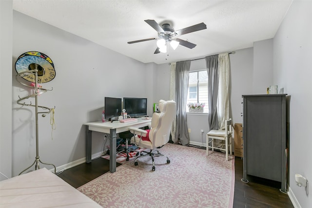 home office with baseboards, ceiling fan, and wood finished floors