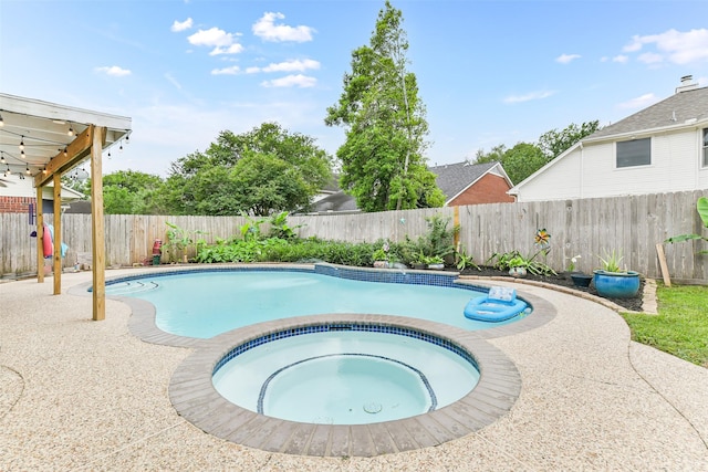 view of pool with an in ground hot tub, a fenced in pool, and a fenced backyard