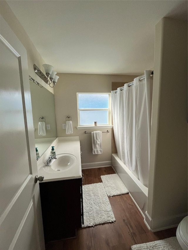 4327 Robertson St, Houston, TX 77009 - full bathroom with vanity, shower / bathtub combination with curtain, wood finished floors, and toilet