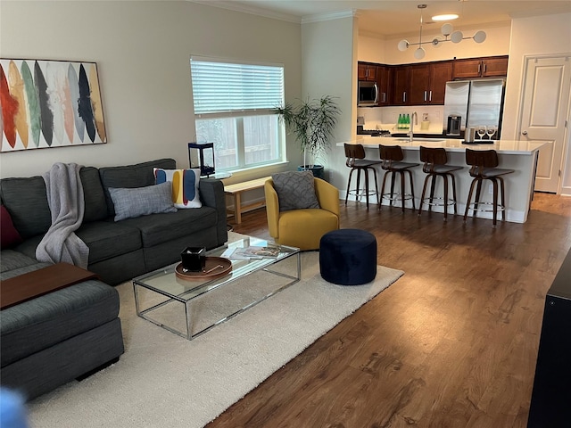 4327 Robertson St, Houston, TX 77009 - living area with crown molding and dark wood-type flooring