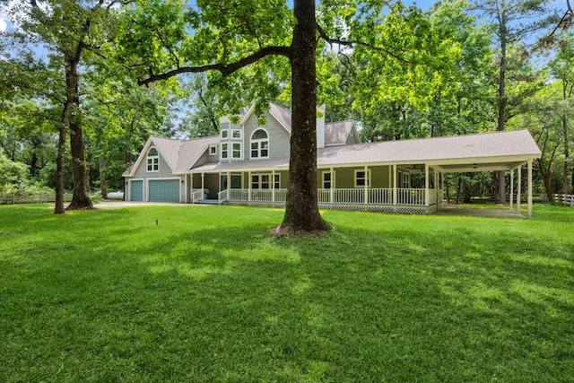back of property featuring a lawn, covered porch, and a shingled roof