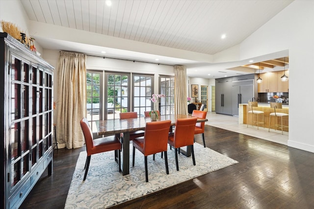 dining area with recessed lighting, baseboards, vaulted ceiling, and wood finished floors