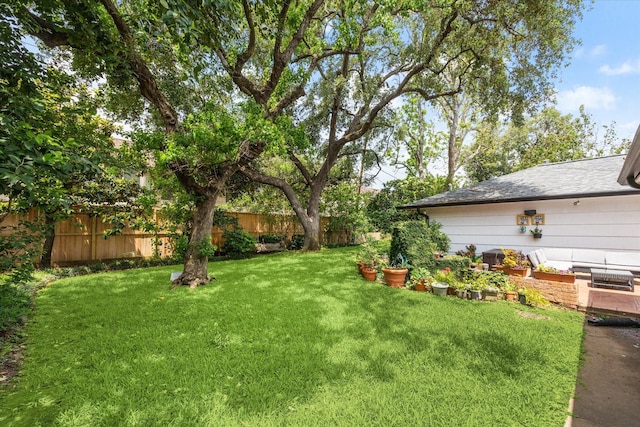 view of yard with a fenced backyard