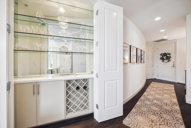 2207 Bancroft St Unit 301, Houston, TX 77027 - indoor dry bar with dark wood-style flooring, recessed lighting, and baseboards