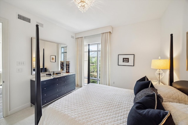 2207 Bancroft St Unit 301, Houston, TX 77027 - bedroom with access to outside, light carpet, baseboards, and a chandelier
