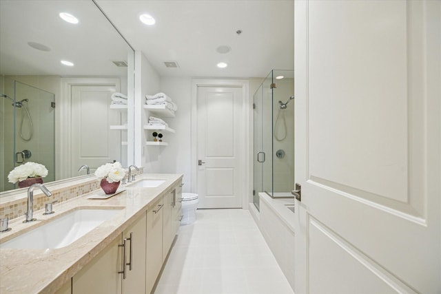 2207 Bancroft St Unit 301, Houston, TX 77027 - full bathroom with a shower stall, recessed lighting, toilet, double vanity, and tile patterned floors