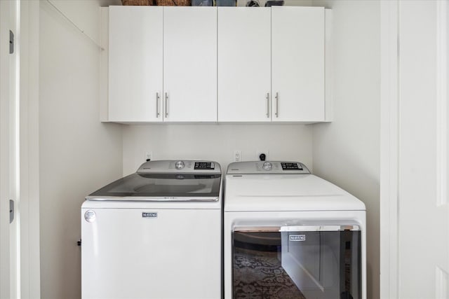 2207 Bancroft St Unit 301, Houston, TX 77027 - laundry room with separate washer and dryer and cabinet space