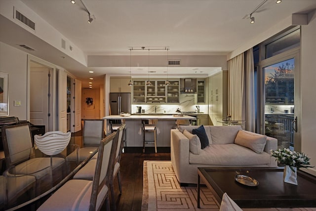 2207 Bancroft St Unit 301, Houston, TX 77027 - living room with rail lighting and dark wood-type flooring