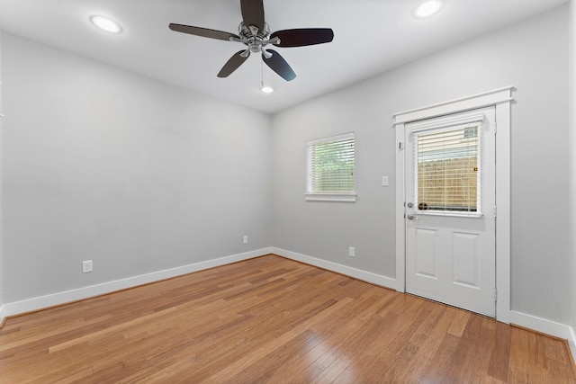 unfurnished room with recessed lighting, baseboards, a ceiling fan, and light wood-style floors