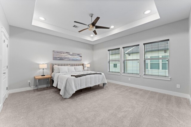 5739 Petty St, Houston, TX 77007 - carpeted bedroom with recessed lighting, a tray ceiling, and ceiling fan