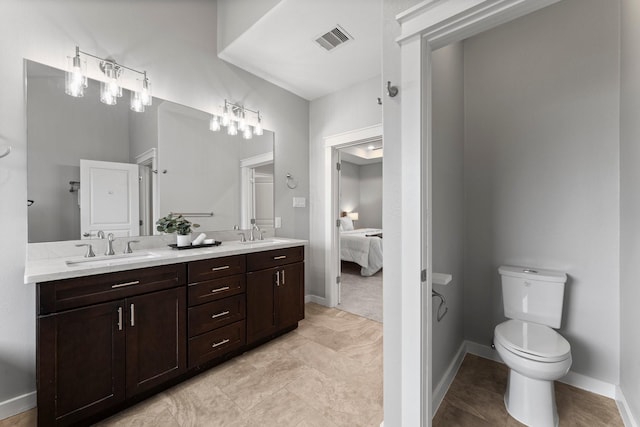 full bathroom with visible vents, a sink, double vanity, and toilet