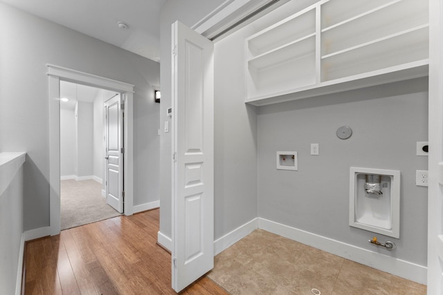 washroom with washer hookup, laundry area, hookup for a gas dryer, electric dryer hookup, and wood finished floors