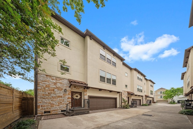 5739 Petty St, Houston, TX 77007 - view of property with a garage, driveway, and a residential view