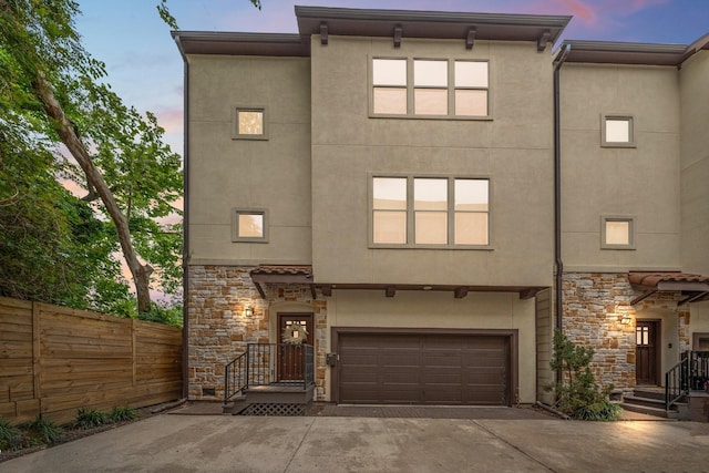 5739 Petty St, Houston, TX 77007 - multi unit property featuring stone siding, driveway, a garage, and stucco siding