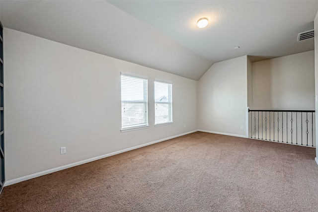 bonus room with carpet floors, baseboards, visible vents, and lofted ceiling