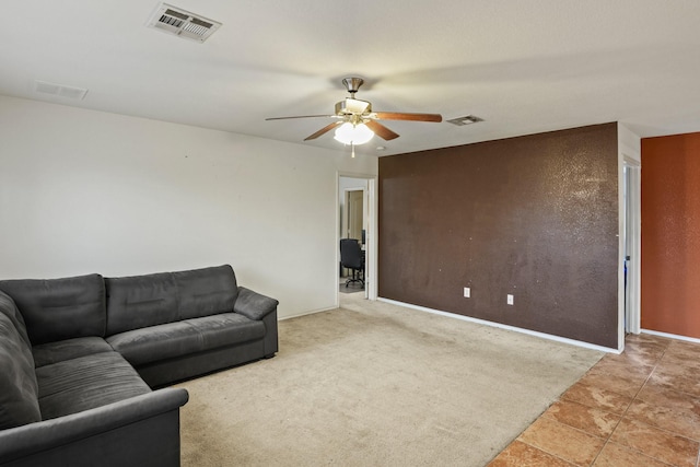 6310 Ringsby Rd, Austin, TX 78747 - living area featuring a ceiling fan, baseboards, and visible vents