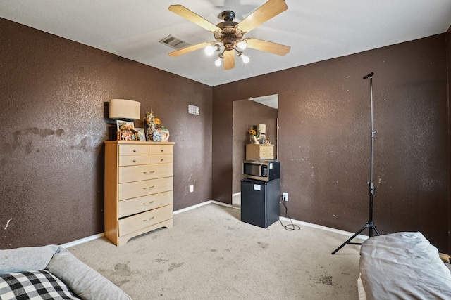 6310 Ringsby Rd, Austin, TX 78747 - carpeted bedroom featuring visible vents, a textured wall, and baseboards