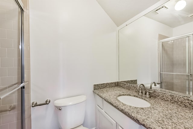 full bath with vanity, visible vents, toilet, and a shower stall