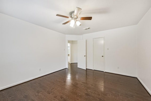 unfurnished bedroom featuring baseboards, a ceiling fan, wood finished floors, and visible vents